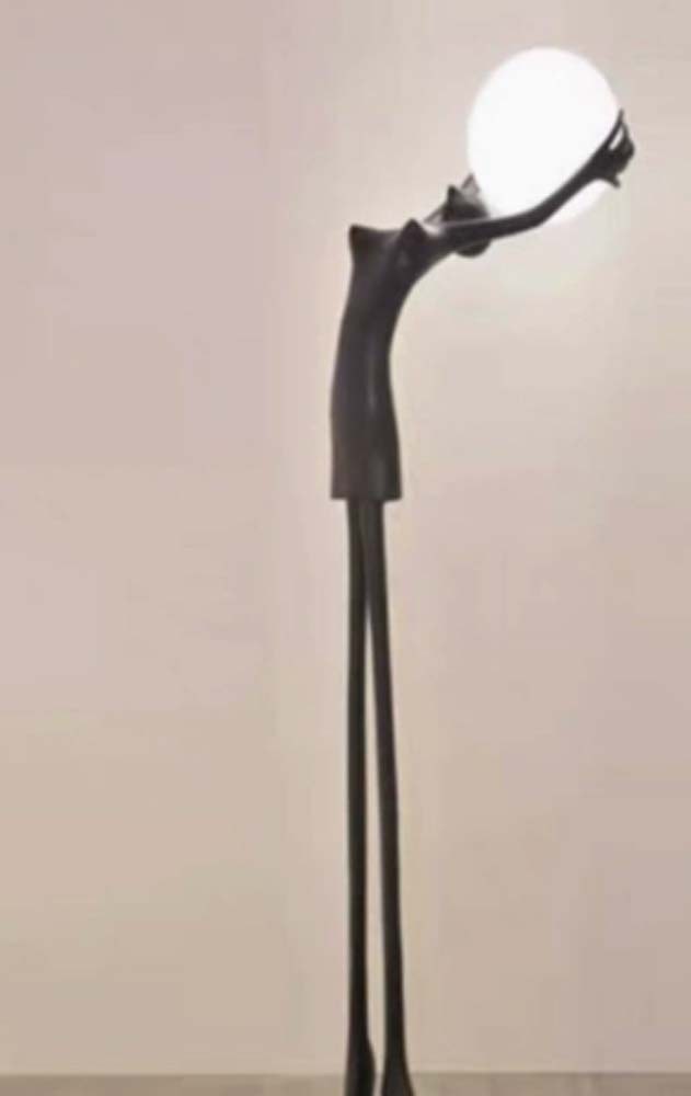 Leaning Figure Globe Lamp