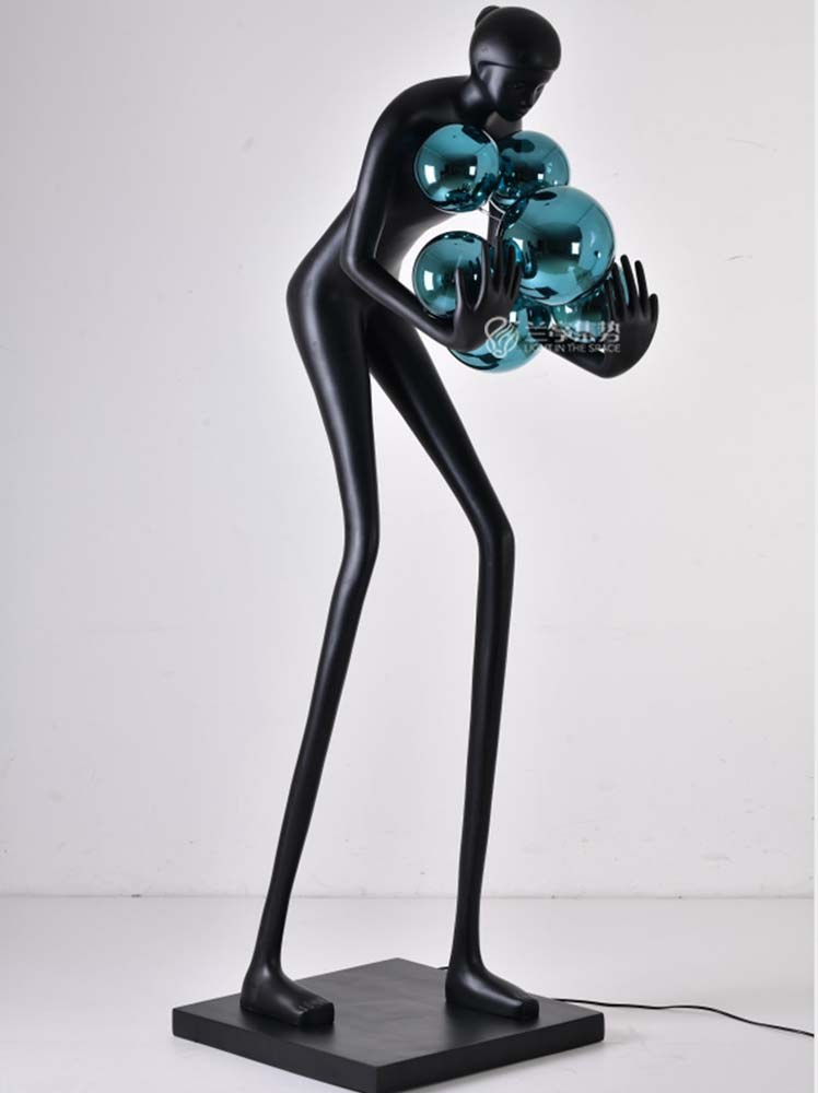 Figure with Red Globes Lamp