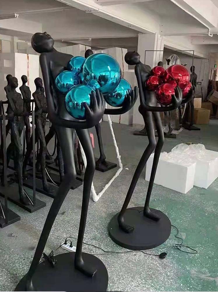 Figure with Red Globes Lamp
